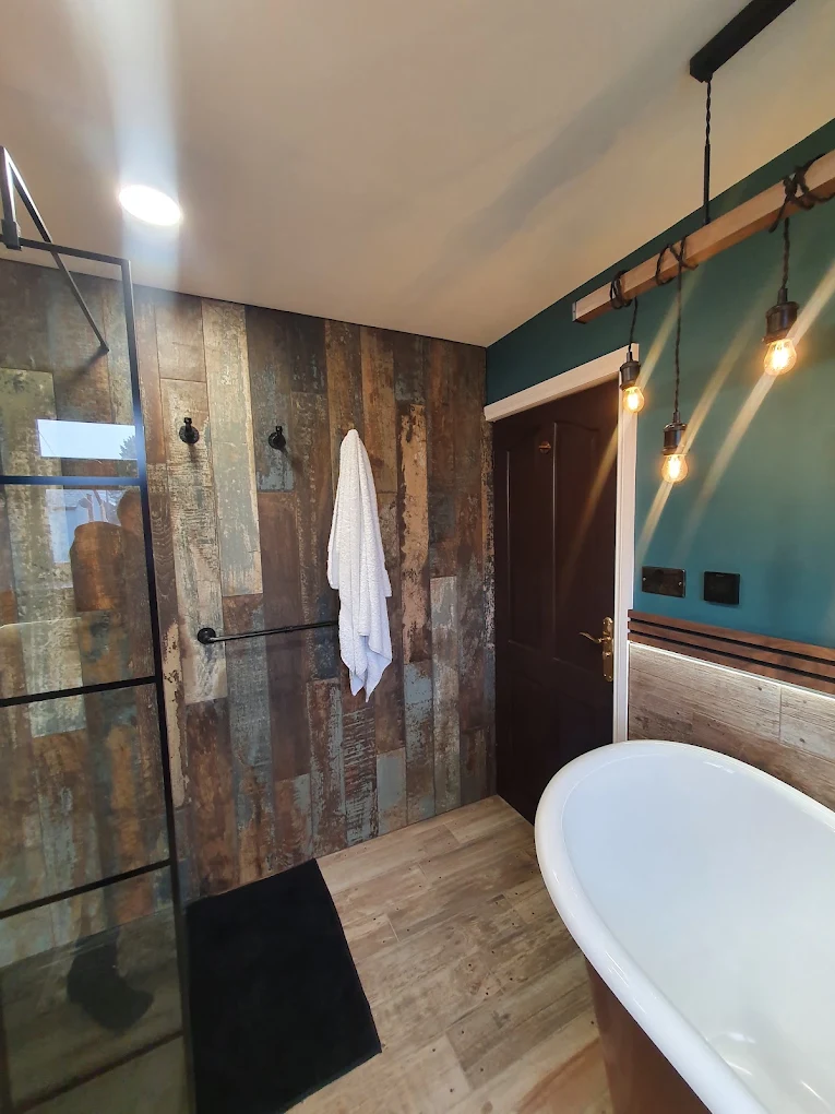 Bathroom renovation with walk-in shower and freestanding bath by CIN Construction